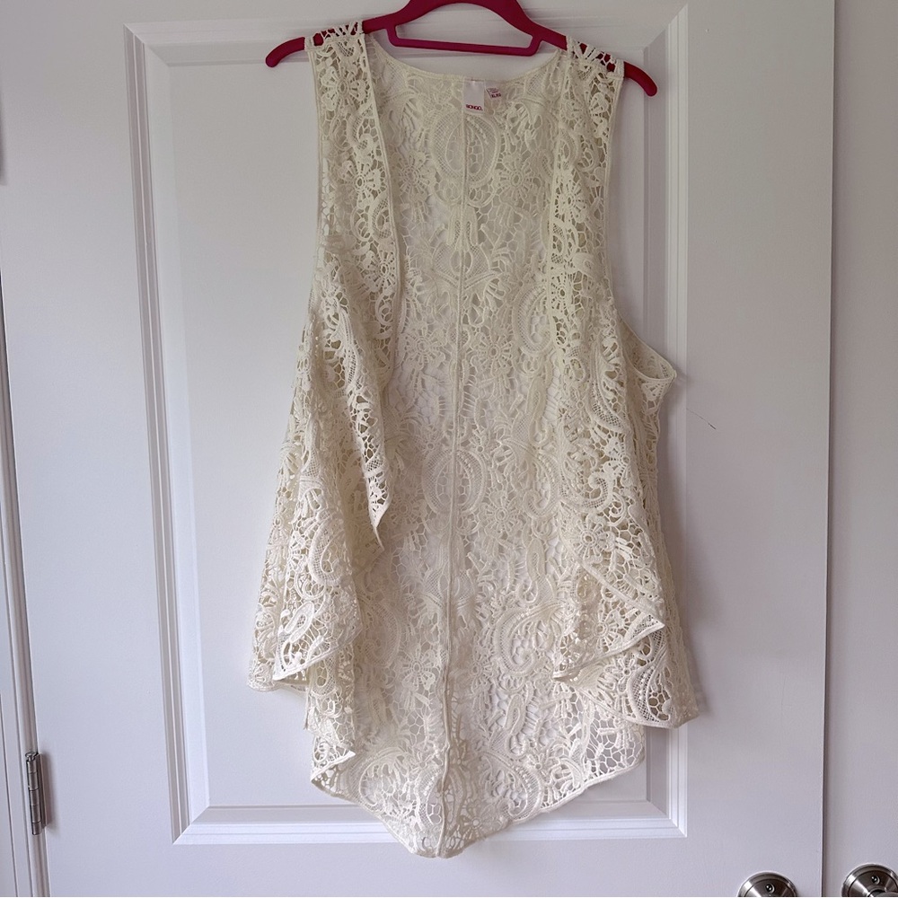 Crochet / lace long vest in cream / off-white. Size
XL, runs a little small